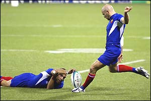 Fly-half Gerald Merceron (right) kicks a conversion for France