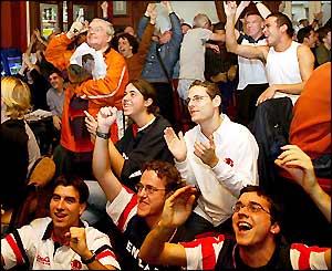 Fans in a London pub watch the Rugby World Cup final