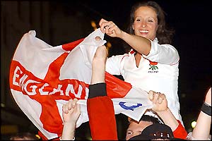 An England fan celebrates victory at The Rocks in Sydney
