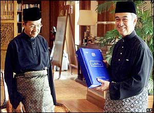 Mahathir Mohamad, left, with Abdullah Ahmad Badawi