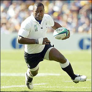 Fiji's Rupeni Caucaunibuca scores the opening try of the game
