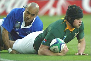 South Africa's Joe van Niekerk crashes over in the second minute