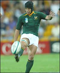 South Africa's fly-half Derick Hougaard clears the ball