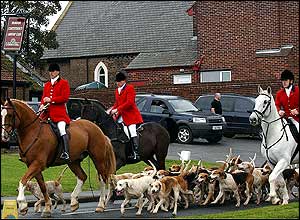 Huntsmen ride past the Trimdon Labour Club, County Durham
