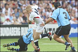 Iain Balshaw breaks through the Uruguay defence on the way to scoring the third try