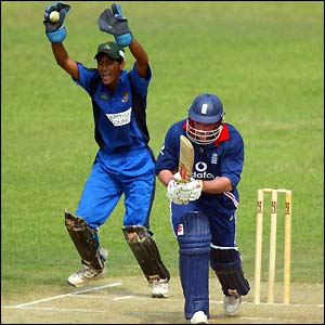 England's Andrew Strauss is caught behind for 51