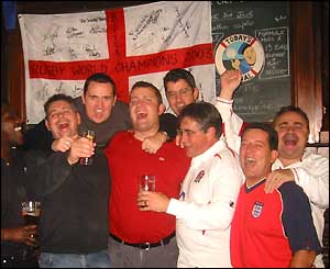 Paul Roberts and friends celebrate in an English pub west of Paris