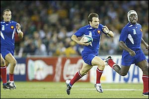 Christophe Dominici races away to score France's second try 