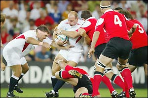 England's Lawrence Dallaglio is stopped in his tracks