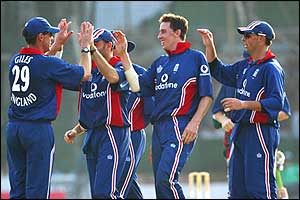 England players celebrate the dismissal of Rajin Saleh