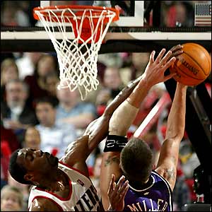 Davis blocks a shot by Miller