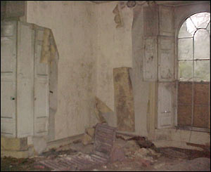 The drawing room is in a severe state of disrepair
