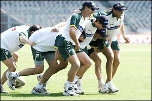 Australia's cricketers enjoy a game of rugby during training in Calcutta