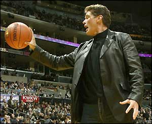 David Hasselhoff holds a basketball in one hand