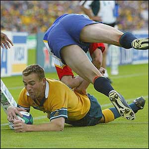 Australian full-back Chris Latham scores one of his record-breaking tries against Namibia