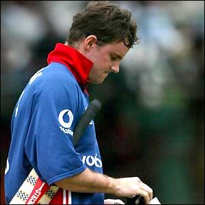 Andrew Strauss walks dejected from the field