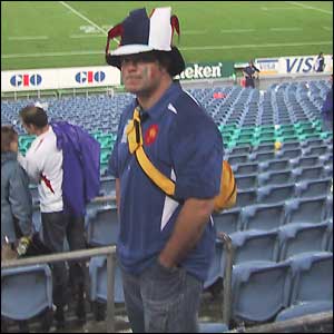 A lone French fan looks sad as he leaves the stadium
