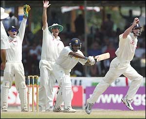 Paul Collingwood (right) successfully appeals for a bat-pad catch off Chaminda Vaas (centre)