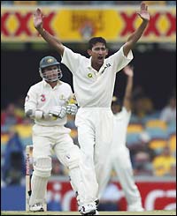 Ajit Agarkar (right) appeals for the wicket of Justin Langer lbw