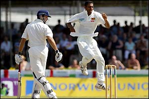 England skipper Michael Vaughan leaves the crease as Dinusha Fernando celebrates