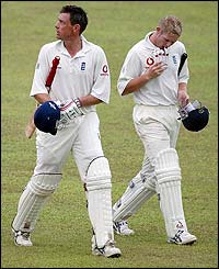 England's Ashley Giles and the last man Matthew Hoggard leave the pitch after earning a thrilling draw