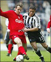 Liverpool's Dietmar Hamann shields the ball from Laurent Robert 