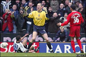 Laurent Robert is fouled by Liverpool keeper Chris Kirkland 