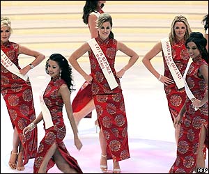 Contestants in traditional Chinese dresses dance at the opening ceremony of the Miss World contest