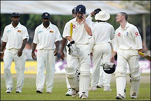 England's Gareth Batty and Chris Read walk off the field