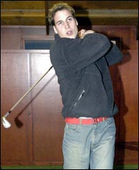 Prince William practices his golf swing