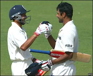 Rahul Dravid (right) is congratulated by team-mate Ajit Agarkar