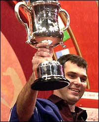 Tony David shows off the trophy in 2002
