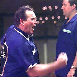 Bobby George celebrates a victory with the crowd