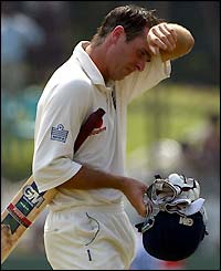 Michael Vaughan leaves the crease after his dismissal