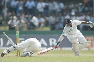Opener Kumar Sangakarra (right) narrowly survives a stumping chance early in the Sri Lankan innings 