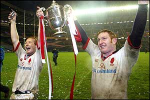 Scrum-half Neil Doak and centre Shane Stewart hold the Celtic Cup aloft