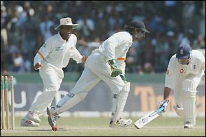 England batsman Graham Thorpe (right) is stumped by Kumar Sangakarra (centre)