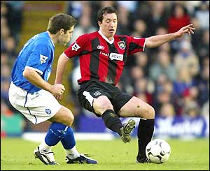 Man City's Robbie Fowler takes on Birmingham's David Dunn