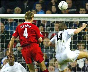 Sami Hyypia rises above Kevin Davies to nod Liverpool into the lead