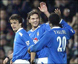 Patrick Berger celebrates with team-mates Alexi Smertin and Yakubu