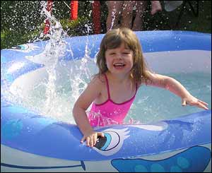 Daughter Bethan enjoying the sun in Rob Ansell's back garden, Rhos-on-Sea, Conwy. north Wales