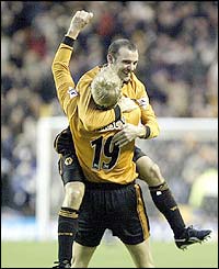 Wolves' Colin Cameron congratulates goalscorer Steffen Iversen