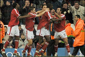 Charlton's players mob goalscorer Carlton Cole
