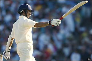 Sachin Tendulkar salutes the crowd after reaching his fifty