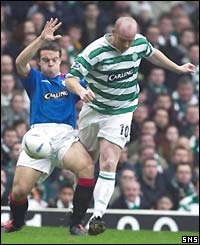 Gavin Rae of Rangers tackles Celtic's John Hartson