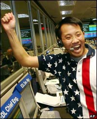 Landing Chief Engineer Wayne Lee whoops for joy as the signal from the Mars Rover Spirit is received.