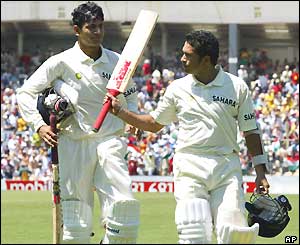 India leave the field after declaring on a record 705-7, with Sachin Tendulkar (right) unbeaten on 241
