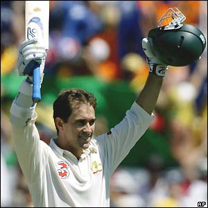 Justin Langer salutes the crowd on reaching his century