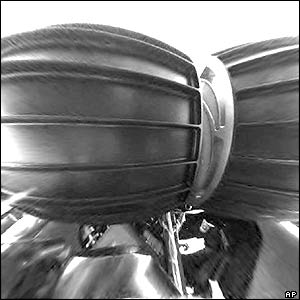 The rover's front wheels in stowed configuration were filmed by the hazard avoidance camera.