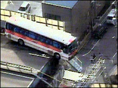 Bus teeters on edge of flyover